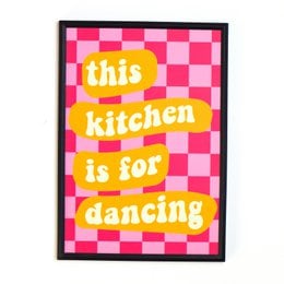 A vibrant yellow poster with the text "Less To-Do's, More Ta-Da's" printed in a bold, playful font. The poster is designed to inspire and motivate, encouraging the viewer to focus on their accomplishments rather than their to-do lists.