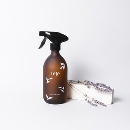 Cypress and lavender scented bathroom/kitchen cleaning product in a brown spray bottle with a black trigger. The product is accompanied by a lavender sprig, indicating the natural, botanical ingredients.