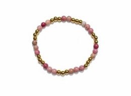 A children's bracelet made of rhodochrosite beads, approximately 16 cm long and 4 mm in diameter.