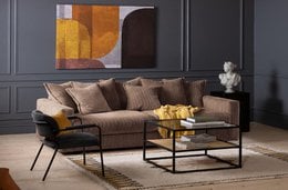 A 3-seater sofa with nougat-colored, removable and washable covers. The sofa features a classic, comfortable design with plush cushions and a sturdy frame.