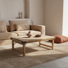  Foldable limewash coffee table made of natural wood with a rustic, distressed finish and a simple, minimalist design.