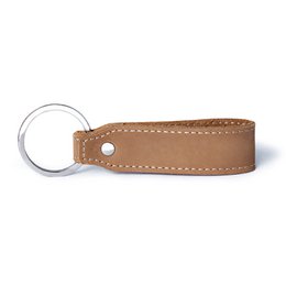 Vintage brown leather keychain with metal ring. Durable and stylish accessory for everyday use.