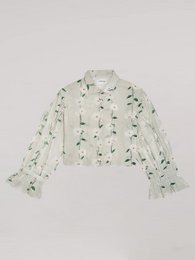  Floral print women's shirt with long sleeves, featuring a loose, relaxed fit and a button-down closure.