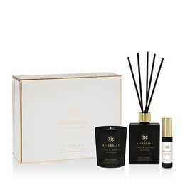  Elegant gift box set containing a lotus and jasmine scented candle, reed diffuser, and perfume spray. Luxurious home fragrance with floral and earthy notes.