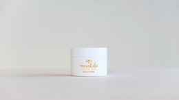 A white jar labeled "Night Cream" containing a moisturizing cream product for the face.