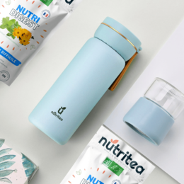 Pastel blue and pink tea infuser bottles with the Nutri Tea logo. The bottles have a sleek, minimalist design and appear to be made of a durable material.
