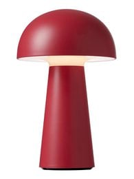 A tall, round, red table lamp with a dome-shaped shade. The lamp has a sleek, modern design and a black power cord.