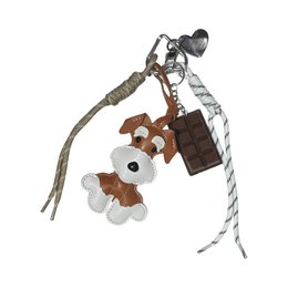  Charm with a plush dog figure, a heart-shaped tag, and a rope-like attachment. The charm appears to be made of metal and fabric materials.