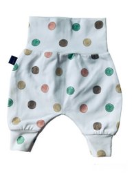 White baby pants with colorful polka dots, suitable for infants and toddlers.