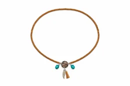 Brown beaded necklace with turquoise stone beads and leather cord pendant, bohemian style jewelry.