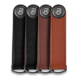 A compact, leather-wrapped key organizer in black, brown, and camel colors. Designed to neatly store and organize keys.