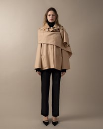 Beige scarf-detail jacket with a flared silhouette, suitable for women's casual or formal wear.