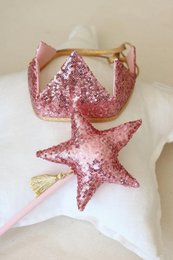 "Sparkling pink sequin crown with star-shaped accent, perfect for dress-up and imaginative play."