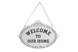  Metal wall sign with "Welcome to our home" text in a decorative frame, measuring 25.5 x 18 cm.