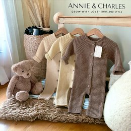 Cozy knit baby rompers in cream and brown colors, featuring a soft and comfortable design with a matching hat. Suitable for infants aged 3-24 months.