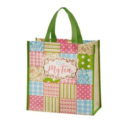 A reusable tote bag made of RPET material, featuring a patchwork design with the text "I love my tea" printed on it. The bag has a green handle and is suitable for carrying tea-related items or as a gift bag.