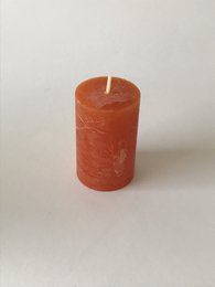 Rustic stumpen candle, 50 x 80 mm, 2.4 inches tall, orange in color.