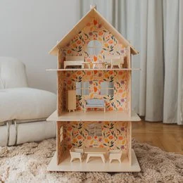 A large, multi-story wooden dollhouse with modern design elements. The dollhouse features multiple rooms and levels, providing ample space for imaginative play.