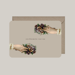  A floral thank you card with an envelope, featuring a bouquet of flowers in warm colors.