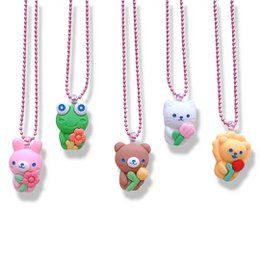 Colorful, whimsical necklaces featuring cute animal-shaped pendants on pink and red beaded chains. The necklaces include a frog, bunny, bear, and heart-shaped pendants, adding a playful, youthful touch.