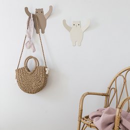 Beige and brown bear-shaped wall hanger for children's clothing and accessories.