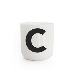 White ceramic mug with large black letter 'C' printed on the front.