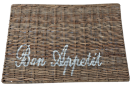 Rectangular woven placemat with "Bon Appetit" text, suitable for dining table settings.