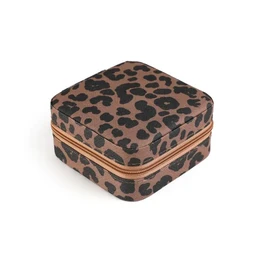 A rectangular jewelry box with a leopard print pattern in shades of brown. The box has a hinged lid and a gold-colored zipper trim around the edges.