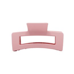 Soft pink hair clip with a rectangular shape, suitable for holding hair in place.