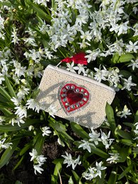  Handcrafted beige pouch with a red heart-shaped gemstone design, perfect for storing small items or as a gift.