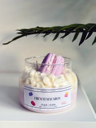  Scented candle with a French macaron-inspired fragrance, featuring a round, tall shape and a purple and white color scheme.