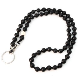 Black beaded keychain with a silver metal ring.