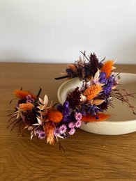 Distinctive dried flower headband with a combination of blue and orange tones.