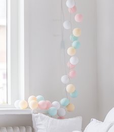 Pastel-colored string lights with an adapter, perfect for decorating any room. The lights feature a variety of soft, muted colors including pink, yellow, and blue, creating a warm and cozy ambiance.