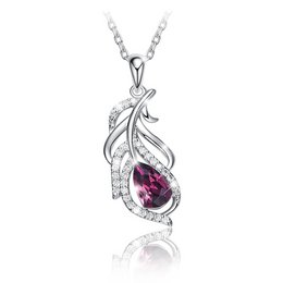 Elegant silver-tone necklace with a teardrop-shaped purple gemstone and decorative leaf-like design.