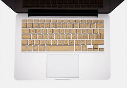Wooden keyboard with various color options for MacBook Pro and Air models. Includes details on materials, style, and shape.