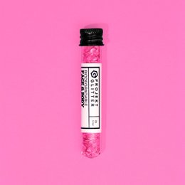 Vibrant pink glitter makeup product with a fluffy, textured applicator.