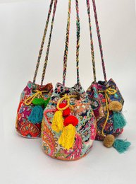  Colorful patchwork bucket bag with vibrant floral embroidery, drawstring closure, bohemian style handbag.