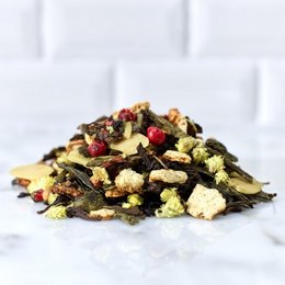 A blend of premium loose leaf tea with a variety of flavors and ingredients, including dried fruit, nuts, and spices. The tea is packaged in a resealable pouch for freshness.
