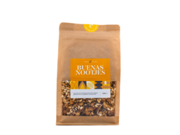 Granola with mixed nuts, including almonds, cashews, and peanuts, in a brown paper bag packaging.