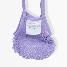 Lightweight, reusable mesh shopping bag in a soft lavender color with a simple text logo.
