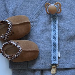  Brown leather pacifier clip with decorative beaded trim, blue striped fabric clip with round wooden attachment.