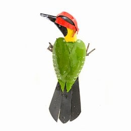 Large metal green woodpecker statue with vibrant red, yellow, and black colors.