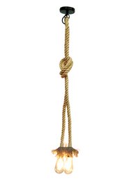 A rustic, pendant lighting fixture made of a black metal base and a long, natural rope with glass bulb holders. The rope is knotted in a decorative pattern, creating a unique, industrial-style design.