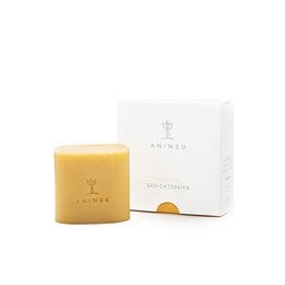 Natural, vegan, and handmade facial soap bar with organic oils, turmeric, and sea buckthorn for cleaning and care. Unique scent in a 60g size.