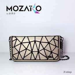 Beige and black geometric pattern handbag with chain strap. Stylish and modern design suitable for everyday use.