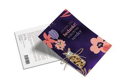  Colorful bouquet of wildflowers including blue, yellow, and red blooms. The bouquet is displayed next to a gift tag with a floral design.