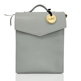  Sörenberg UniTote backpack in various vegetarian leather colors including black, gunpowder, light grey, caramel, sky blue, taupe, deep forest, and tan. The backpack features a minimalist, envelope-style design with a tag.