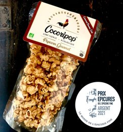 Gourmet popcorn with salted butter caramel flavor, packaged in a clear bag.
