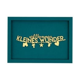 A wooden frame with the text "WELCOME LITTLE MIRACLE" and decorative elements like a magnet and baby-themed lettering. The frame is available in various color variants.